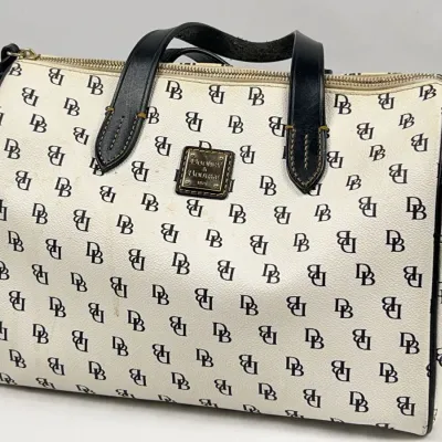 Dooney & Bourke vintage monogram DB coated canvas satchel handbag with black leather trim and handles.