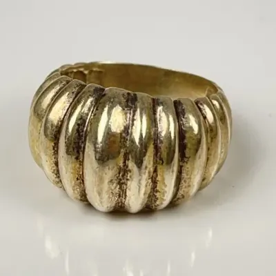 Vintage gold-toned chunky ribbed dome ring with a textured, segmented design.