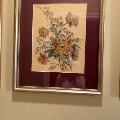 Framed botanical floral print featuring colorful chrysanthemums, housed in a metallic champagne frame with a deep burgundy mat.
