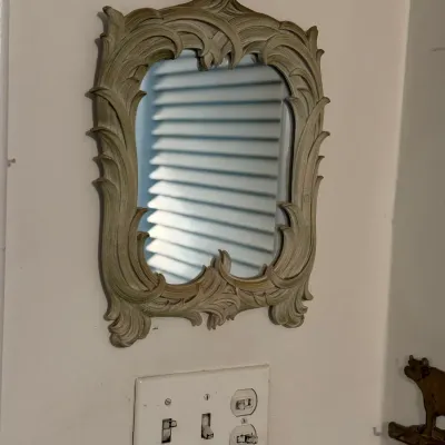 Sale Photo Thumbnail #168: Small vintage wall mirror with an ornate, acanthus leaf carved style frame, finished in a muted muted beige tone.