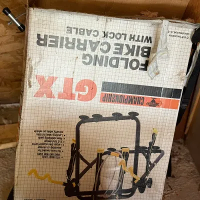 Sale Photo Thumbnail #221: Vintage Championship GTX folding bike carrier with lock cable in its original printed cardboard box.