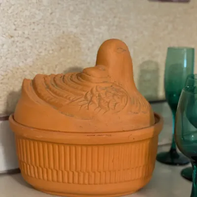 Sale Photo Thumbnail #147: Terracotta chicken-shaped covered baker or roaster dish with textured detailing.