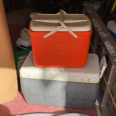Sale Photo Thumbnail #213: Vintage red Thermos portable cooler stacked on top of a larger gray and white hardshell ice chest cooler.