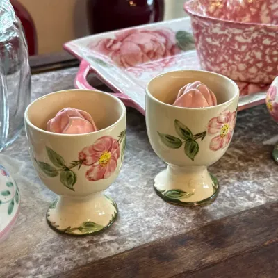 Sale Photo Thumbnail #108: Vintage Franciscan Desert Rose salt and pepper shakers in pedestal holder cups, featuring hand-painted floral motifs.