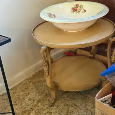 Sale Photo Thumbnail #68: Vintage floral ceramic wash basin resting on a painted cream two-tier round side table with curved legs.