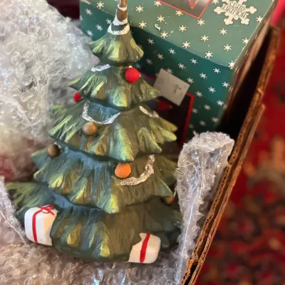 Sale Photo Thumbnail #60: Hand-painted ceramic Christmas tree figurine adorned with ornaments, glitter garland, and presents at the base, displayed in its original Holiday Gifts box.