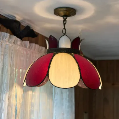 Sale Photo Thumbnail #193: Vintage Tiffany-style hanging pendant light featuring alternating red and cream slag glass panels with brass ceiling hardware.