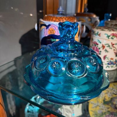 Sale Photo Thumbnail #7: Vintage aqua blue glass Moon and Stars pattern covered butter dish, displayed on a glass shelf in excellent condition.