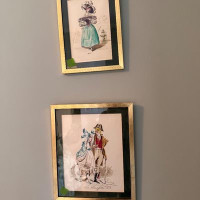 Sale Photo Thumbnail #48: Pair of framed vintage French fashion illustration prints in matching gold-finished wooden frames with black matting.