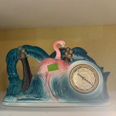 Sale Photo Thumbnail #75: Vintage Sarsaparilla Art Deco style ceramic table clock featuring a pink flamingo and palm trees.