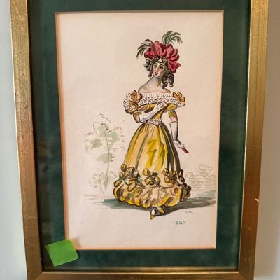 Sale Photo Thumbnail #52: Framed vintage fashion illustration watercolor depicting a woman in an 1829 yellow gown, presented under glass with a dark green mat and a gilt wood frame.