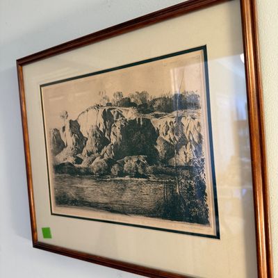 Sale Photo Thumbnail #43: Framed black and white etching featuring a rocky landscape scene, mounted under glass with a double mat and warm wood frame.