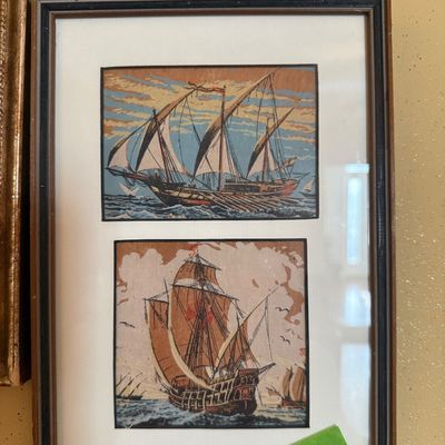 Sale Photo Thumbnail #71: Framed nautical art piece featuring two vintage illustrations of historic sailing ships, presented under glass with a white mat and dark wood frame.