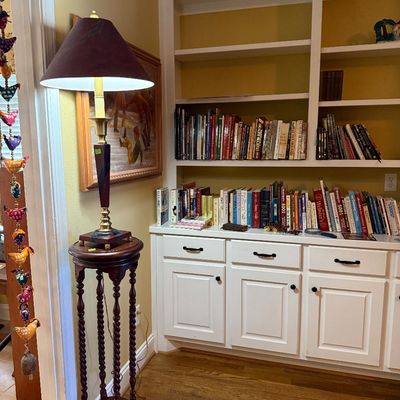 Sale Photo Thumbnail #37: Tall vintage dark wood plant stand featuring barley twist legs, topped with a brass table lamp with a dark fabric shade.