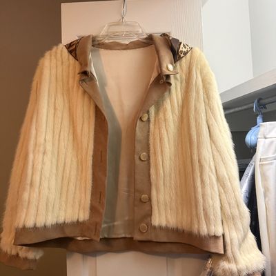 Sale Photo Thumbnail #63: Vintage blonde fur and suede jacket featuring a button-front closure and leopard print lining accents on the collar.