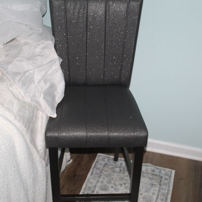 Sale Photo Thumbnail #89: Modern high-back counter stool featuring dark grey glittery upholstery and vertical channel tufting.
