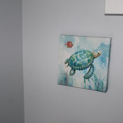 Sale Photo Thumbnail #34: Square wrapped canvas wall art featuring a sea turtle and small orange fish in an underwater watercolor style.