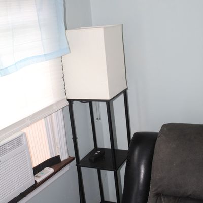 Sale Photo Thumbnail #24: Modern black metal shelf floor lamp featuring a tall rectangular fabric shade and integrated display tiers.