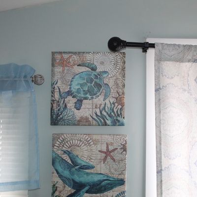 Sale Photo Thumbnail #95: Pair of square, coastal-themed canvas wall art prints featuring sea turtles and whales in teal tones.