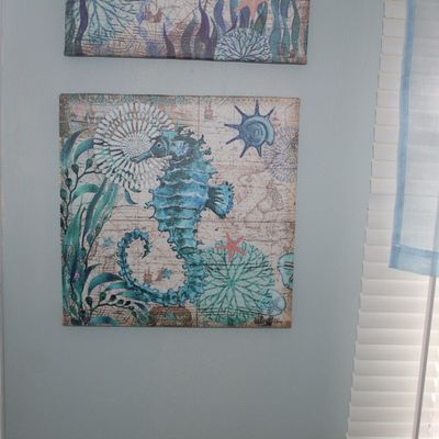 Sale Photo Thumbnail #26: Coastal-themed canvas wall art featuring a blue seahorse and sea flora over a vintage map background.