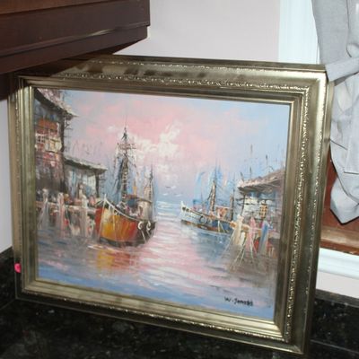 Sale Photo Thumbnail #8: Framed oil painting depicting a coastal harbor scene with fishing boats at dusk, signed W. Jones, housed in an ornate silver-toned wood frame.