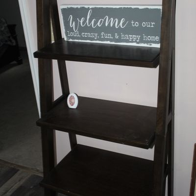 Sale Photo Thumbnail #7: Dark wood five-tier leaning ladder shelf displayed with decorative home signs and small decor accents.