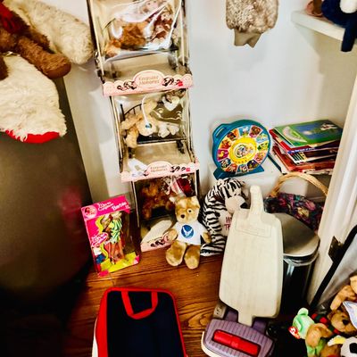 Sale Photo Thumbnail #29: Collection of vintage toys and dolls, including boxed Keepsake Memories porcelain dolls, a vintage Barbie, stuffed animals, a toy See 'n Say, and a plastic toy vacuum cleaner.