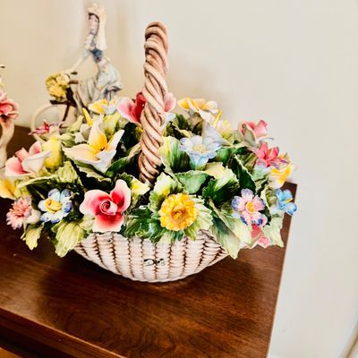 Sale Photo Thumbnail #10: Italian Capodimonte-style porcelain flower basket centerpiece featuring hand-painted colorful blossoms and a twisted handle.