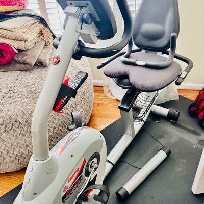 Sale Photo Thumbnail #42: Schwinn BioFit recumbent stationary exercise bike featuring an adjustable seat, digital display console, and foot straps.