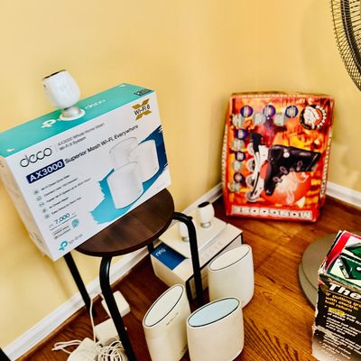 Sale Photo Thumbnail #72: TP-Link Deco AX3000 whole home mesh Wi-Fi 6 system with box and units, along with boxed Mongoose inline skates and a putting green set.