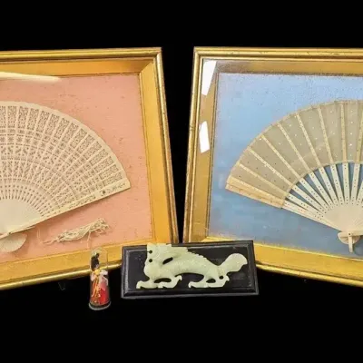 Vintage Asian Decorative Collection Featuring Framed Fans, Jade-Style Carving, & Miniature Figure  