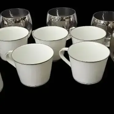 Noritake Fine China Coffee/Tea Pieces  
Galaxy #6527) & Silver Roly-Poly Glasses  