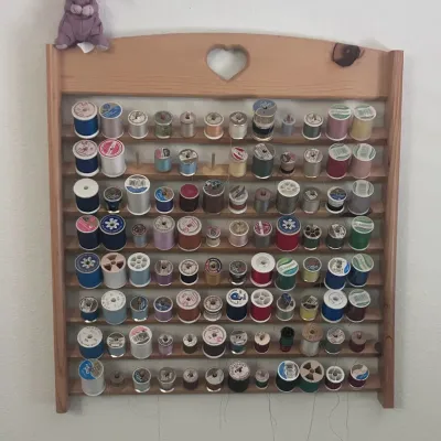 Sale Photo Thumbnail #103: O wooden thread holder with thread