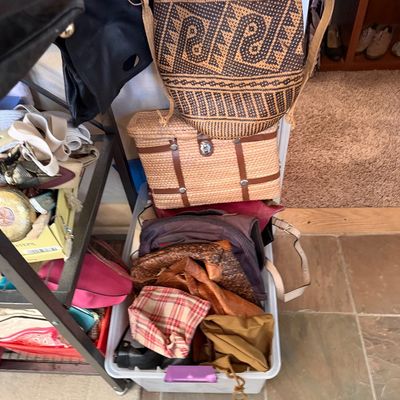Collection of assorted handbags and woven shoulder bags, including a woven geometric pattern bucket bag and a wicker latch-closure bag...