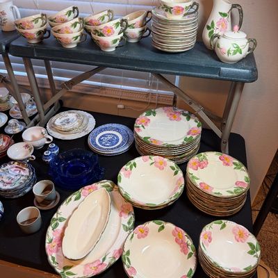 Large set of Franciscan Desert Rose pattern ceramic dinnerware, including teacups, saucers, plates, bowls, serving platters, and a...