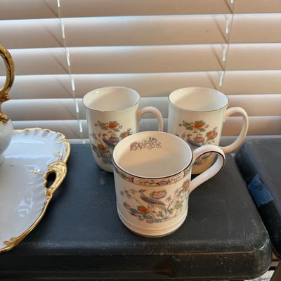 Set of three fine bone china mugs featuring a colorful peacock, floral, and botanical motif with gilt trim.