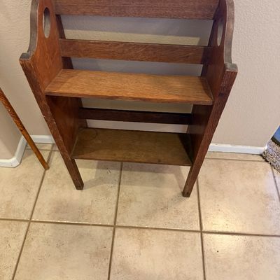Vintage Mission Craftsman style wooden bookshelf rack featuring two angled shelves and cut-out handles.