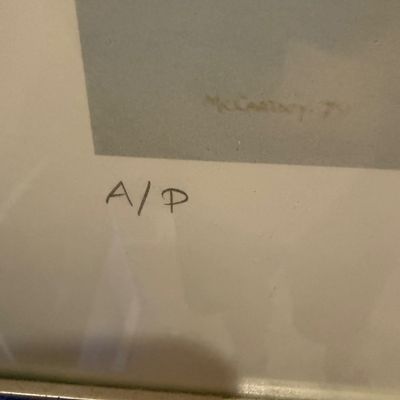 Close-up detail of a framed artwork showing the artist signature 'McCartney 77' and an 'A/P' artist's proof mark...
