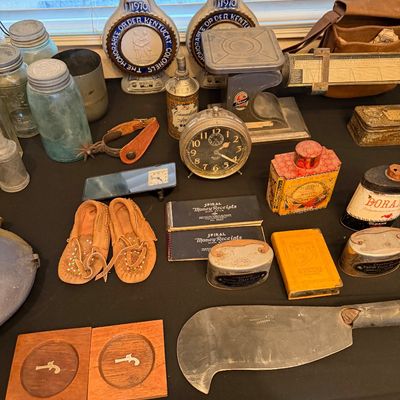 A collection of vintage items including 1970 Kentucky Colonels whiskey decanters, a balance scale, moccasins, a large meat cleaver,...