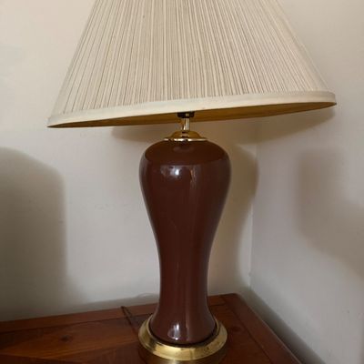 Sale Photo Thumbnail #117: Vintage table lamp featuring a chocolate brown ceramic urn-form body, brass accents, and a large pleated fabric shade.