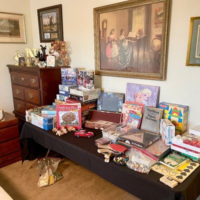 Sale Photo Thumbnail #15: Collection of board games, jigsaw puzzles, poker chips, and framed artwork and dark wood dresser