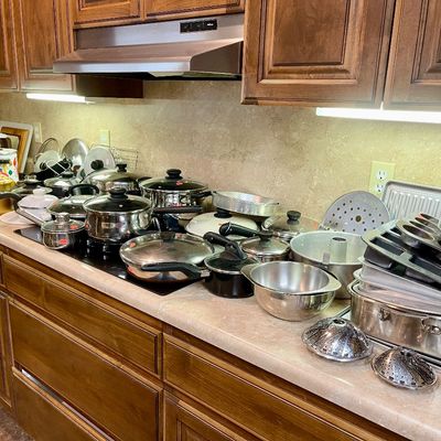 Sale Photo Thumbnail #5: Large collection of kitchenware, including stainless steel pots and pans, baking sheets, muffin tins, and roasting pans