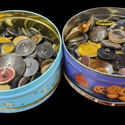 Sale Photo Thumbnail #37: Two vintage cookie tins filled with an assortment of antique and vintage sewing buttons in various colors, shapes, and materials.
