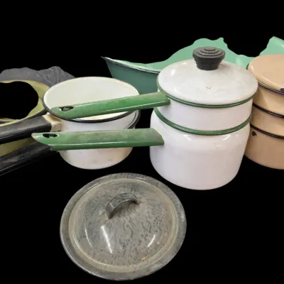 Sale Photo Thumbnail #46: Collection of vintage enamelware cookware, including double boilers, saucepans, and a speckled pot lid.