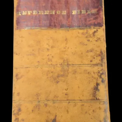 Sale Photo Thumbnail #22: Antique 19th-century leather-bound Reference Bible featuring gilt lettering on a red spine label with significant wear and age-related patina.