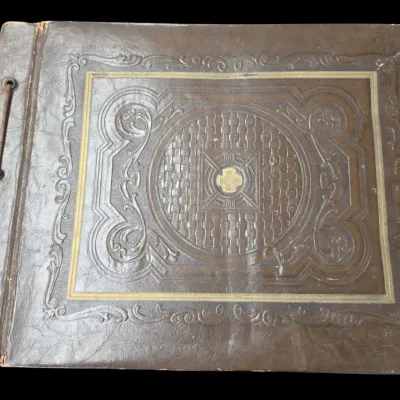 Sale Photo Thumbnail #12: Antique embossed faux leather photo album with string binding and gilt geometric accents, early 20th century.