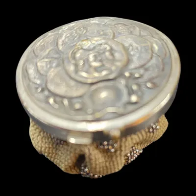 Sale Photo Thumbnail #45: Antique silver-toned reticule purse featuring a carved mother-of-pearl top lid and beaded mesh body.
