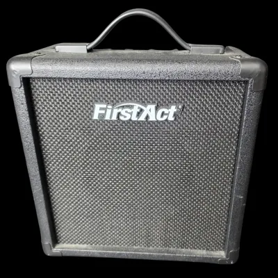Sale Photo Thumbnail #23: Compact First Act guitar practice amplifier with black textured vinyl casing, corner protectors, and a top carrying handle.
