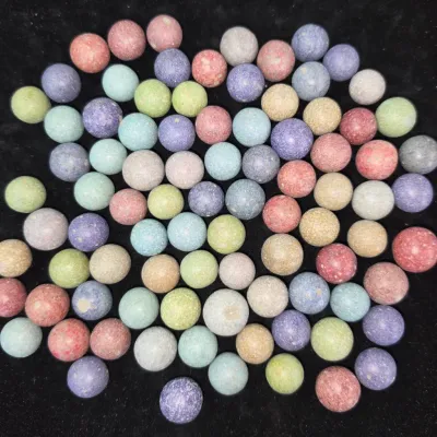 Sale Photo Thumbnail #155: Large collection of vintage clay marbles in assorted matte pastel colors.