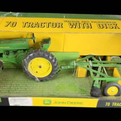 Sale Photo Thumbnail #67: Vintage Ertl 1/16 scale John Deere Model 70 tractor with disk attachment in original display box.